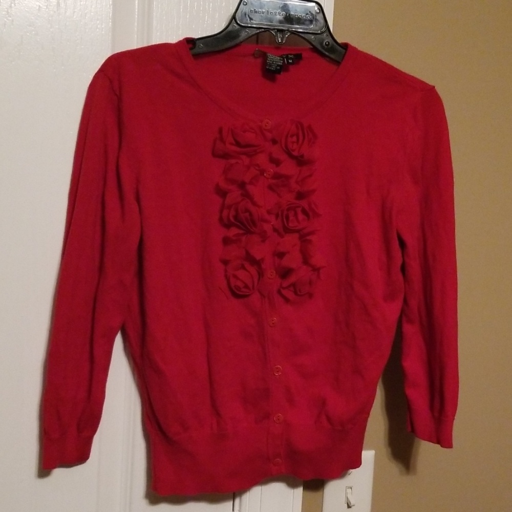 Red sweater with ruffle details